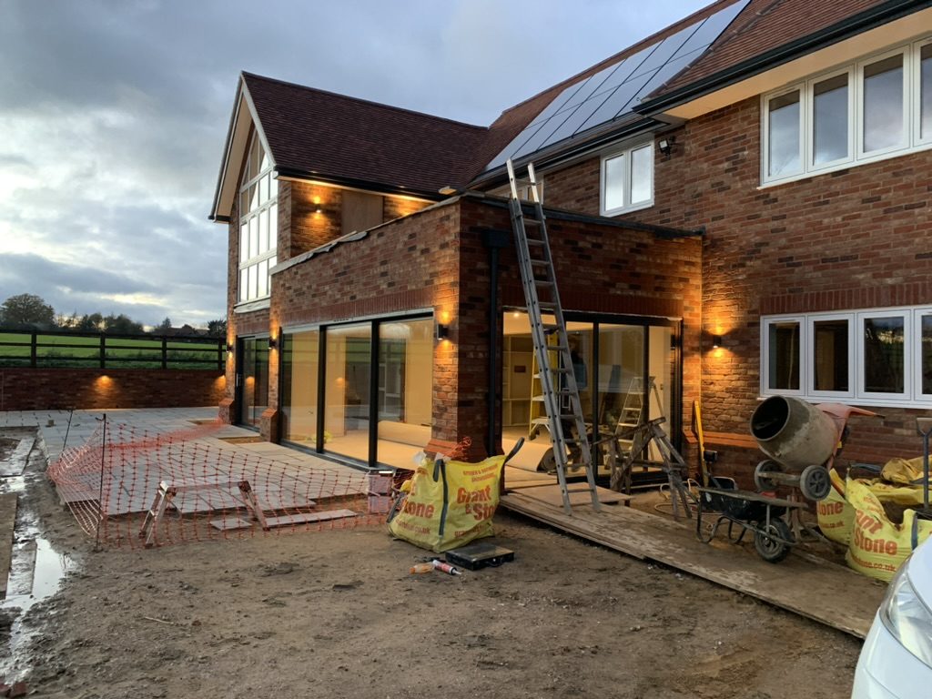 Outdoor Lighting — Paths, patios, soffits and planting lit properly — and wired to survive a British winter.